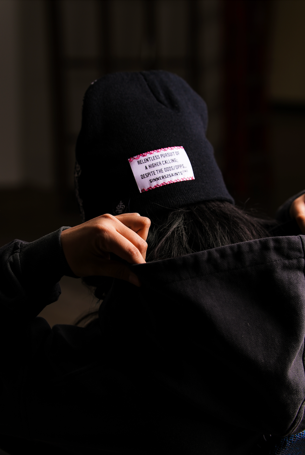 The Mantle Beanie worn back view — wool-feel acrylic knit, Sinners2Saints